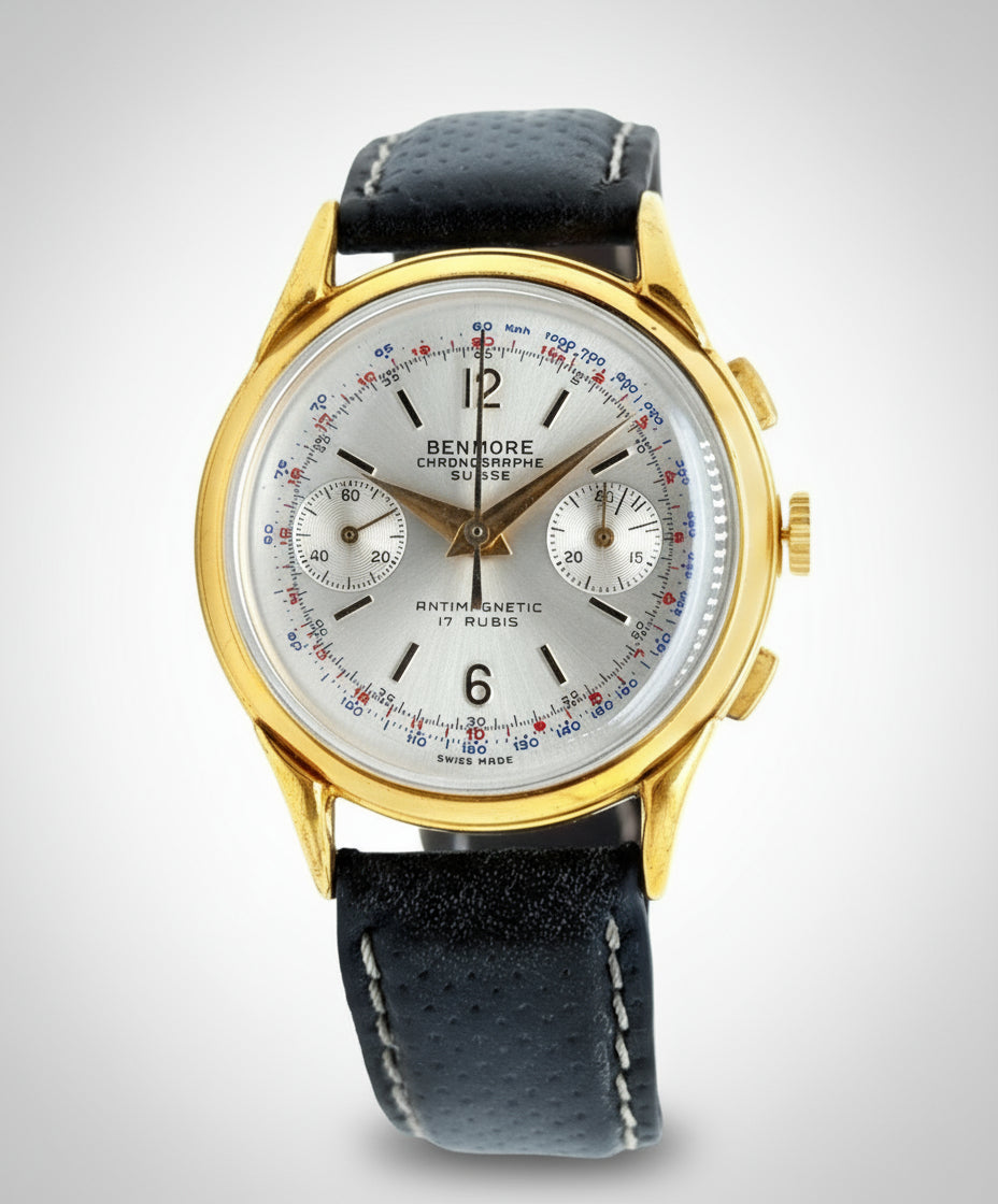 Luxury watch with gold case and black leather strap on a white background