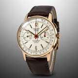 Vintage-style watch with brown leather strap on a white background