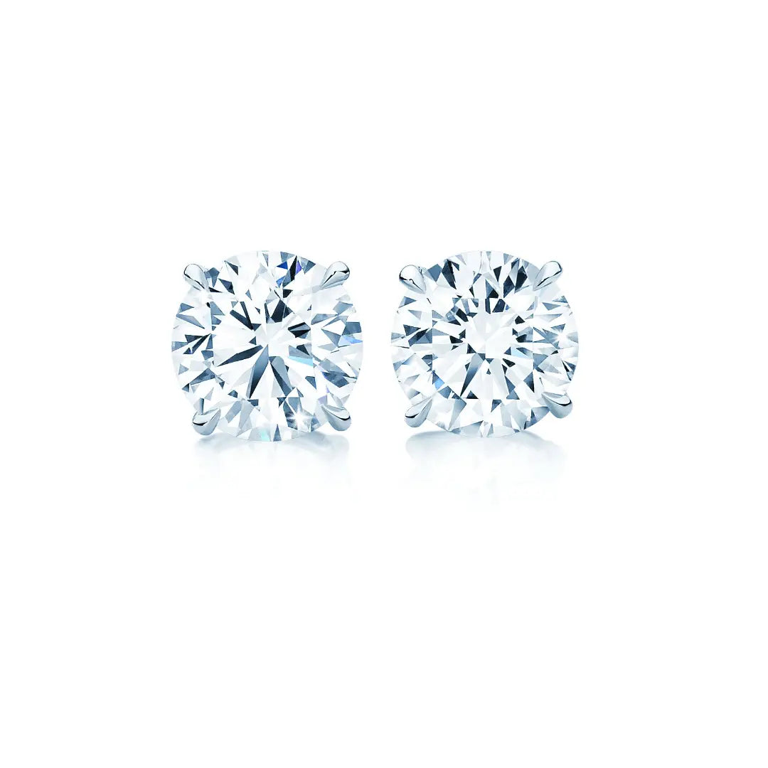 Round Brilliant Cut Diamond studs in platinum with talon claws. Handmade luxury in the UK and Ireland for engagement rings, wedding bands, eternity rings and classic jewellery.