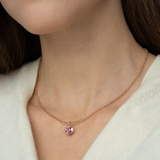 Asscher cut blush pink tourmaline set with a hidden halo of diamonds in an 18ct rose gold pendant Handmade luxury in the UK and Ireland for engagement rings, wedding bands, eternity rings and classic jewellery.