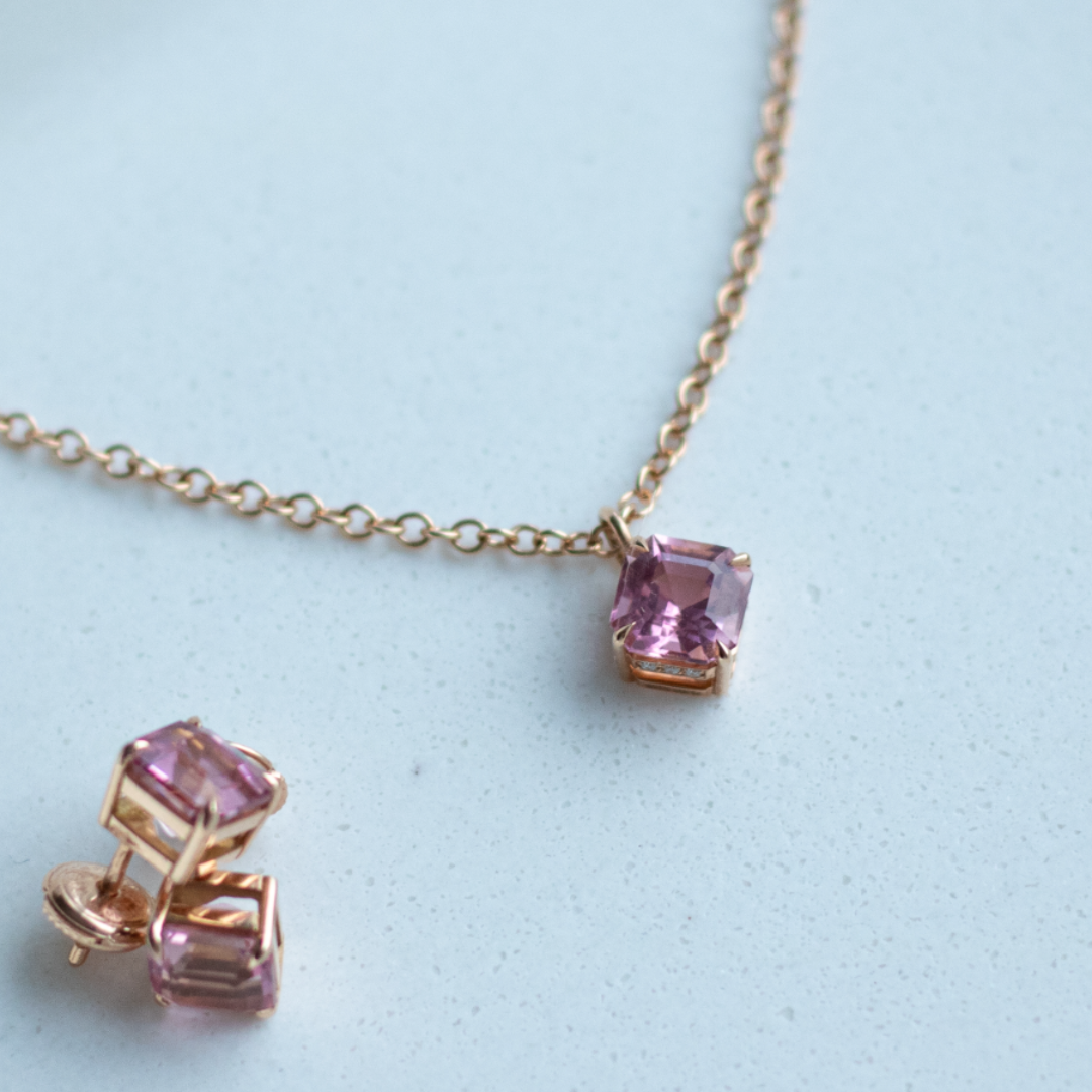 Asscher cut blush pink tourmaline set with a hidden halo of diamonds in an 18ct rose gold pendant Handmade luxury in the UK and Ireland for engagement rings, wedding bands, eternity rings and classic jewellery.