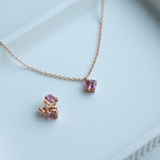 Asscher cut blush pink tourmaline set with a hidden halo of diamonds in an 18ct rose gold pendant Handmade luxury in the UK and Ireland for engagement rings, wedding bands, eternity rings and classic jewellery.