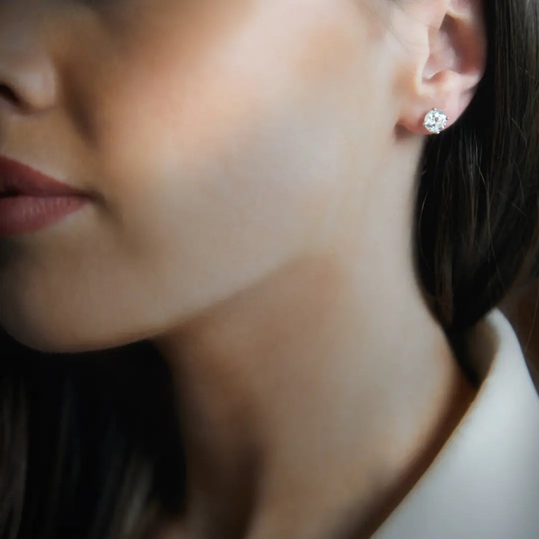 Round Brilliant Cut Diamond studs in platinum with talon claws. Handmade luxury in the UK and Ireland for engagement rings, wedding bands, eternity rings and classic jewellery.