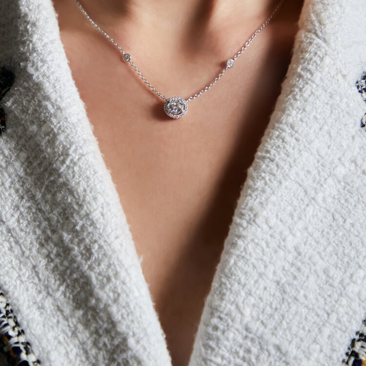 Platinum and diamond pendant featuring a Royal halo design and diamond set chain in Dublin, London, Manchester, Ireland and the UK. Fine jewellery, engagement and wedding rings, Bridal luxury, Irish and British craftsmanship