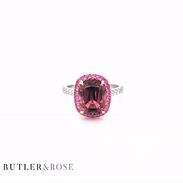 4.44cts Pink Tourmaline Royal Ring. Pink Tourmaline Cushion with Pink Sapphire Halo in Rose Gold and Diamond Set Platinum Band. Handmade luxury in the UK and Ireland for engagement rings, wedding bands, eternity rings and classic jewellery.