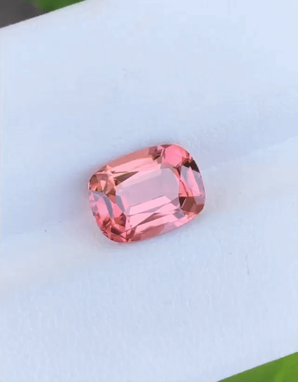 2.81cts Pinky-Orange Tourmaline w/ diamond claws and shoulders. Cushion cut pink-orange tourmaline with diamond set claws, and diamond set band. Handmade luxury in the UK and Ireland for engagement rings, wedding bands, eternity rings and classic jewellery.