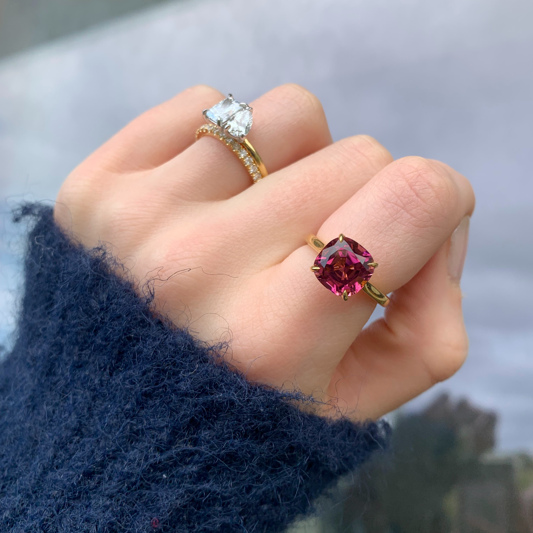 Cushion cut pink tourmaline set with a hidden halo in 18ct rose gold. Handmade luxury in the UK and Ireland for engagement rings, wedding bands, eternity rings and classic jewellery.