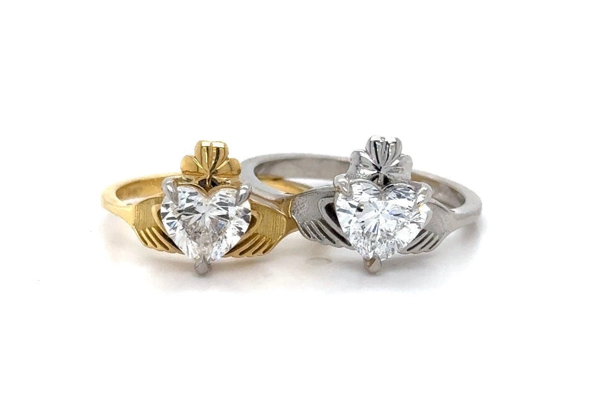 Gold and Platinum claddagh rings with diamond hearts and hand set in relief