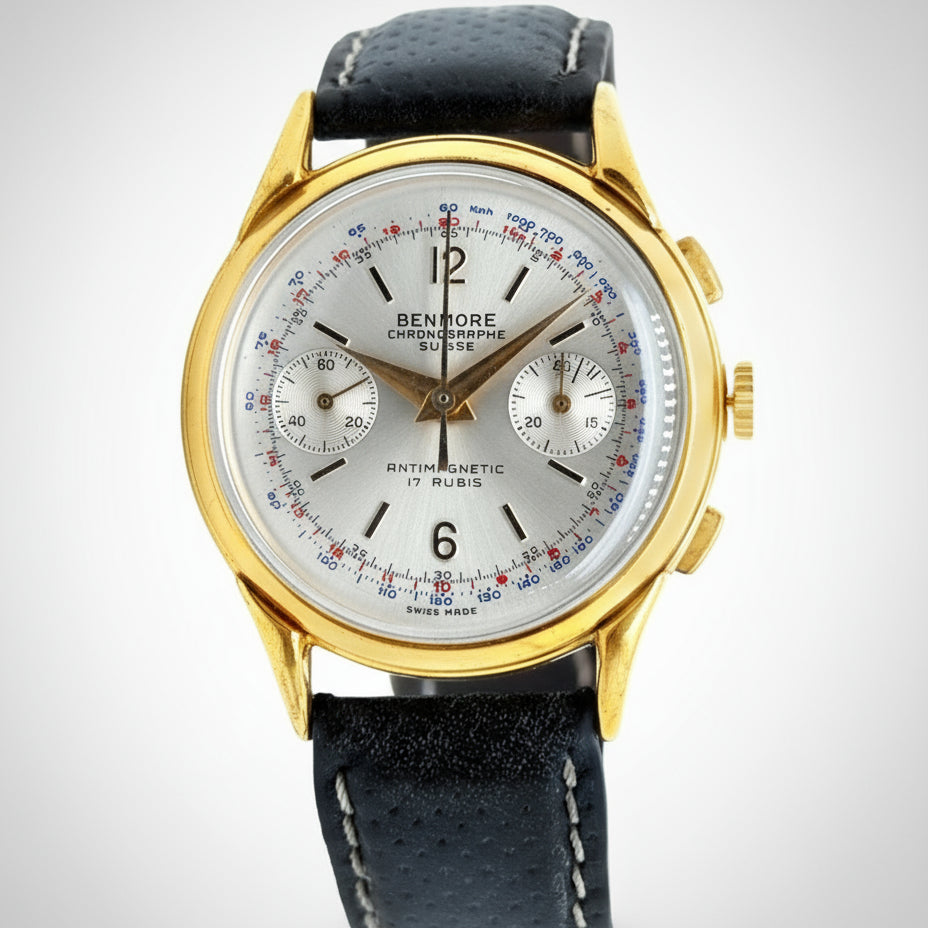 Luxury watch with gold case and black leather strap on a white background