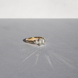 Emerald cut diamond with pear cut diamond shoulders and platinum claws and an 18ct yellow gold band. Handmade luxury in the UK and Ireland for engagement rings, wedding bands, eternity rings and classic jewellery.