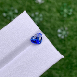 Heart shaped blue sapphire bezel set  with a hidden diamond halo in platinum. Handmade luxury in the UK and Ireland for engagement rings, wedding bands, eternity rings and classic jewellery.