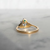Hidden green emerald, behind a shamrock crown on the butler and rose Claddagh ring in 18ct yellow gold.