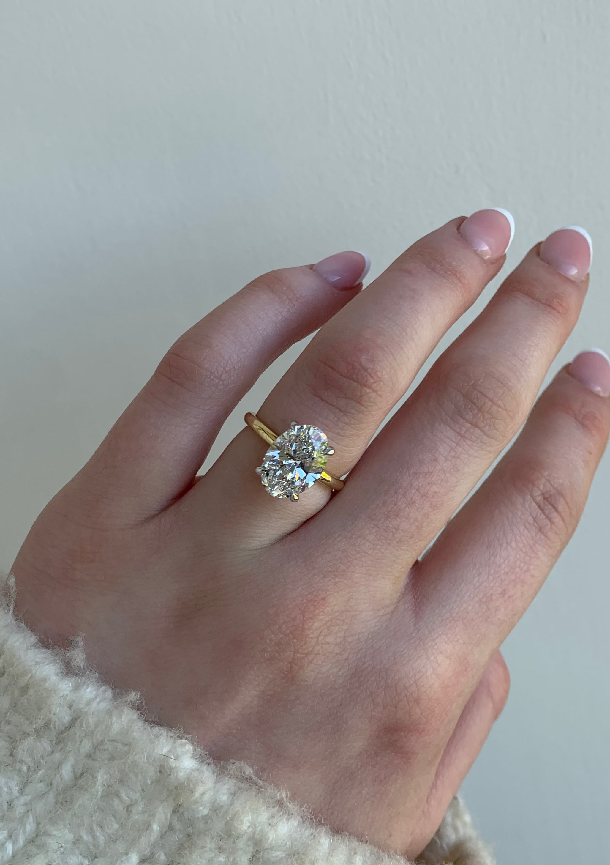 Oval diamond engagement ring, 18ct Gold band, and hidden diamond halo. Designer ring made in Dublin