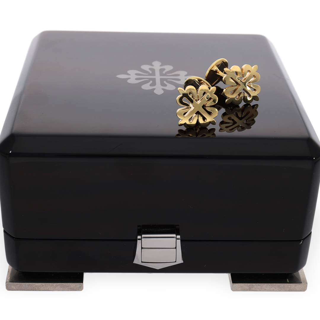 18ct yellow gold Patek Philippe Calatrava Cross cufflinks with presentation box. Handmade luxury in the UK and Ireland for engagement rings, wedding bands, eternity rings and classic jewellery.