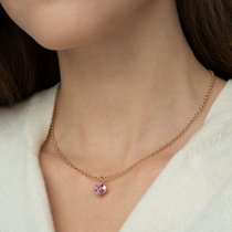 Asscher cut blush pink tourmaline set with a hidden halo of diamonds in  an 18ct rose gold pendant Handmade luxury in the UK and Ireland for engagement rings, wedding bands, eternity rings and classic jewellery.