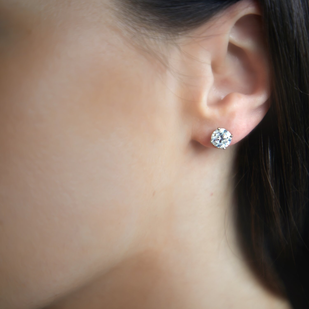 Round Brilliant Cut Diamond studs in platinum with talon claws. Handmade luxury in the UK and Ireland for engagement rings, wedding bands, eternity rings and classic jewellery.