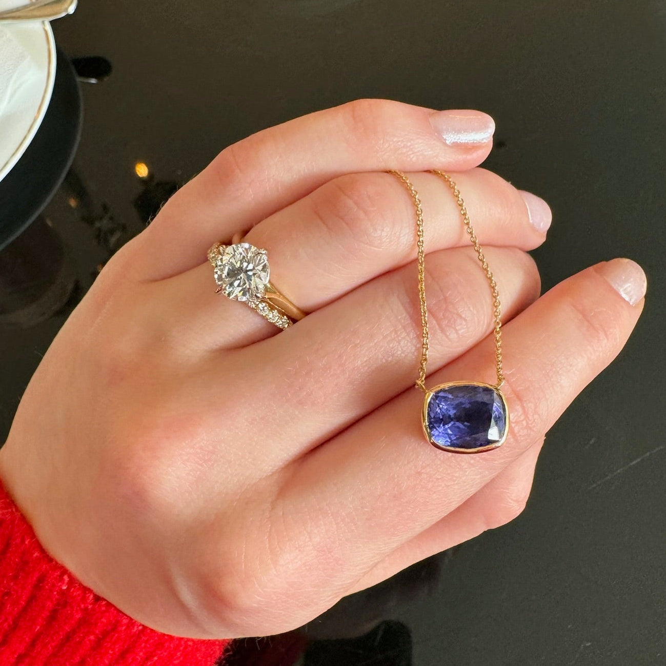 5.34ct Cushion Tanzanite pendant, set in 18ct yellow gold. With a Diamond solitaire engagement ring and Diamond pave wedding eternity band in platinum, made in dublin by Butler & Rose jewellers.