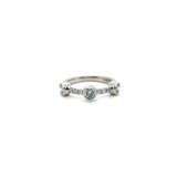 Three stone diamond eternity, wedding band in platinum with diamond pave band. Worn with Butler & Rose jewellers diamond pave eternity band in platinum.
