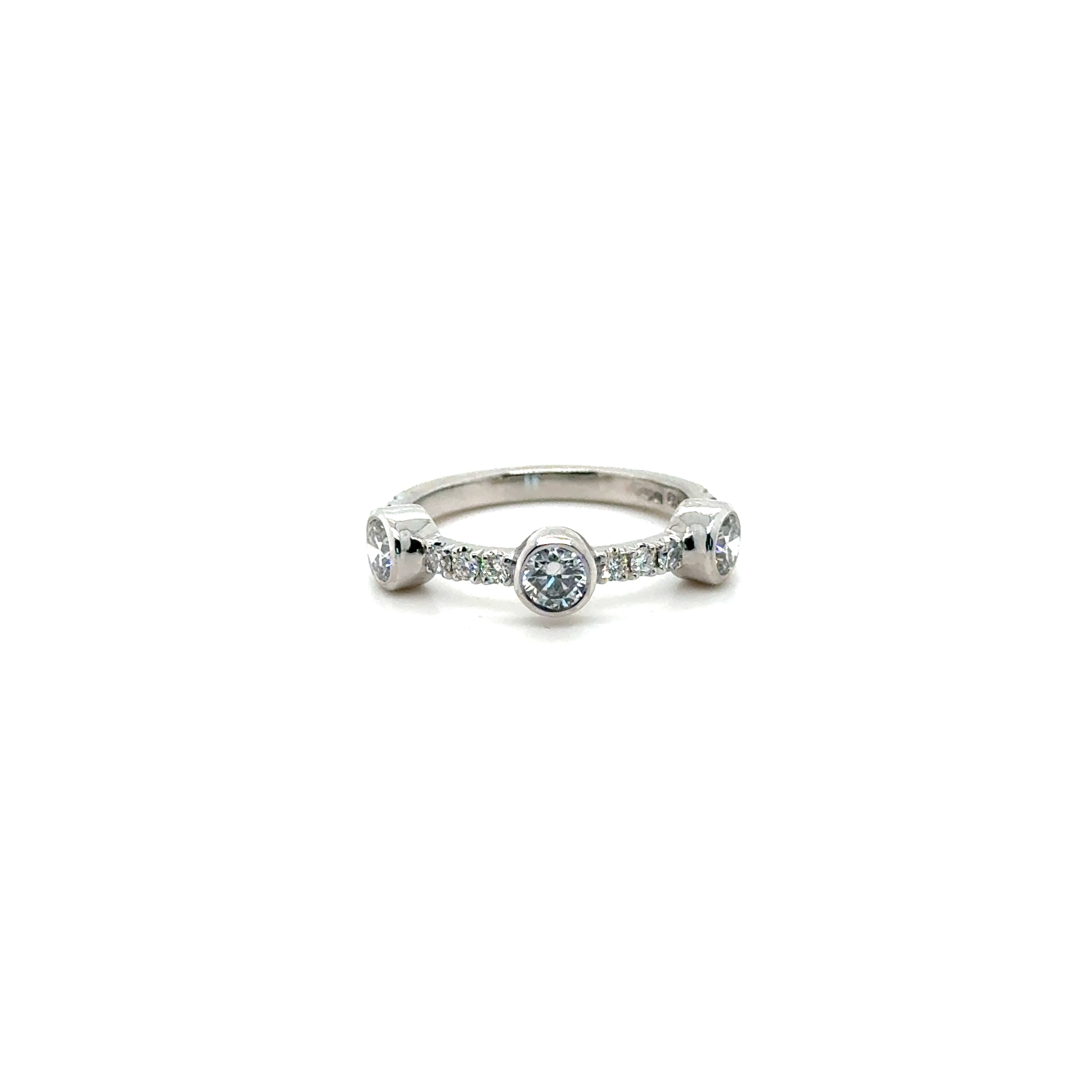 Three stone diamond eternity, wedding band in platinum with diamond pave band. Worn with Butler & Rose jewellers diamond pave eternity band in platinum.