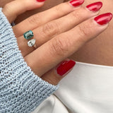 Toi et Moi with a green cushion cut tourmaline and pear cut diamond with platinum claws on a platinum band. Handmade luxury in the UK and Ireland for engagement rings, wedding bands, eternity rings and classic jewellery.