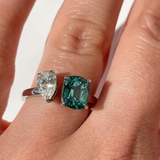 Toi et Moi with a green cushion cut tourmaline and pear cut diamond with platinum claws on a platinum band. Handmade luxury in the UK and Ireland for engagement rings, wedding bands, eternity rings and classic jewellery.
