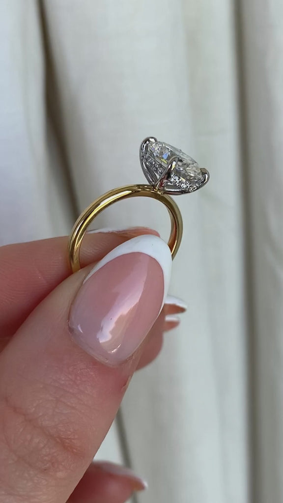 Oval diamond engagement ring, 18ct Gold band, and hidden diamond halo. Designer ring made in Dublin