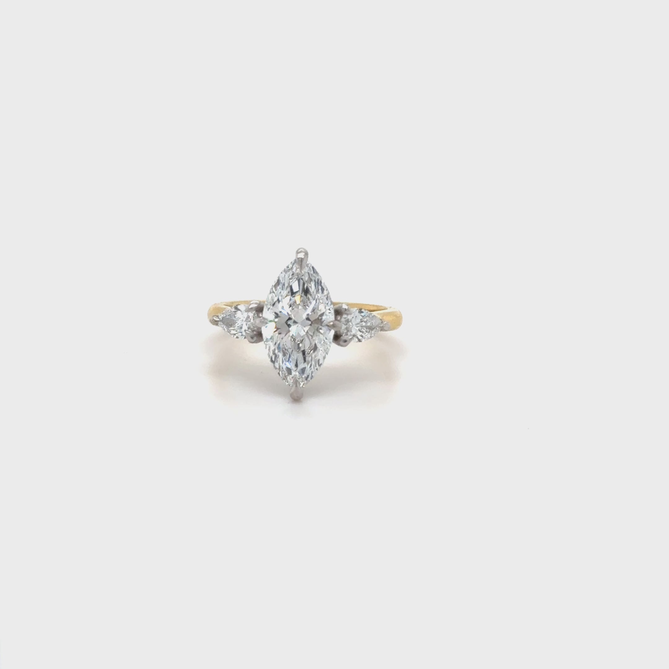 Marquise diamond with pear shoulders on a n18ct yellow gold band handmade bespoke in Ireland and the K for engagement rings or special occasions