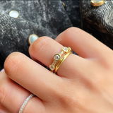 18ct Gold and diamond eternity ring with small stones on a person's finger designed by butler and rose jewellers in ireland. 