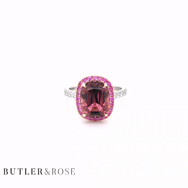 4.44cts Pink Tourmaline Royal Ring. Pink Tourmaline Cushion with Pink Sapphire Halo in Rose Gold and Diamond Set Platinum Band. Handmade luxury in the UK and Ireland for engagement rings, wedding bands, eternity rings and classic jewellery.